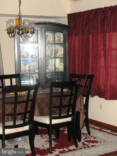 9025 Fieldchat Road Nottingham, MD 21236 - Photo 2 of 11 a view of a dining room with furniture and window