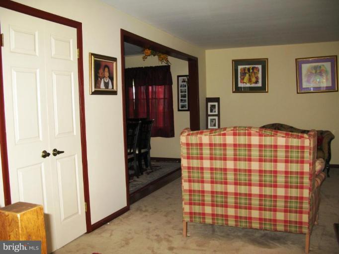 9025 Fieldchat Road Nottingham, MD 21236 - Photo 6 of 11 a bedroom with a bed and dresser