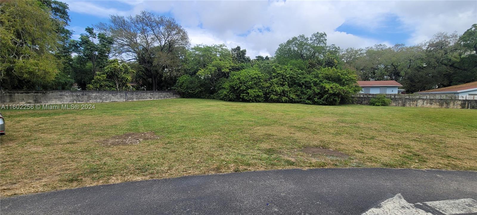 567 Northwest 90th Street, Unit 3 Miami, FL 33150 - Photo 11 of 11 a view of a garden with a chair