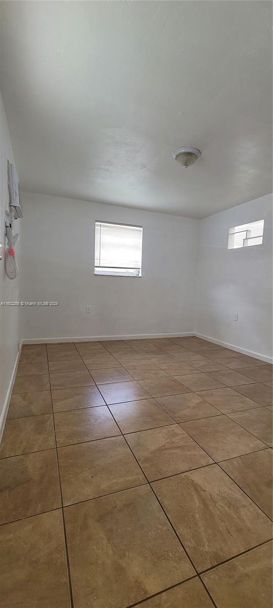 567 Northwest 90th Street, Unit 3 Miami, FL 33150 - Photo 5 of 11 a view of an empty room and window