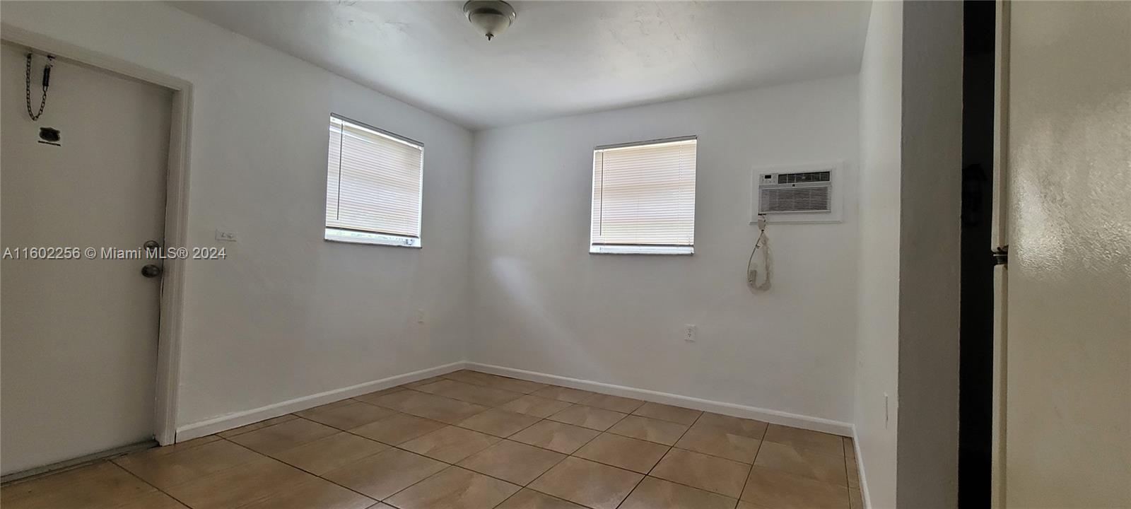 567 Northwest 90th Street, Unit 3 Miami, FL 33150 - Photo 8 of 11 a view of a livingroom with a window
