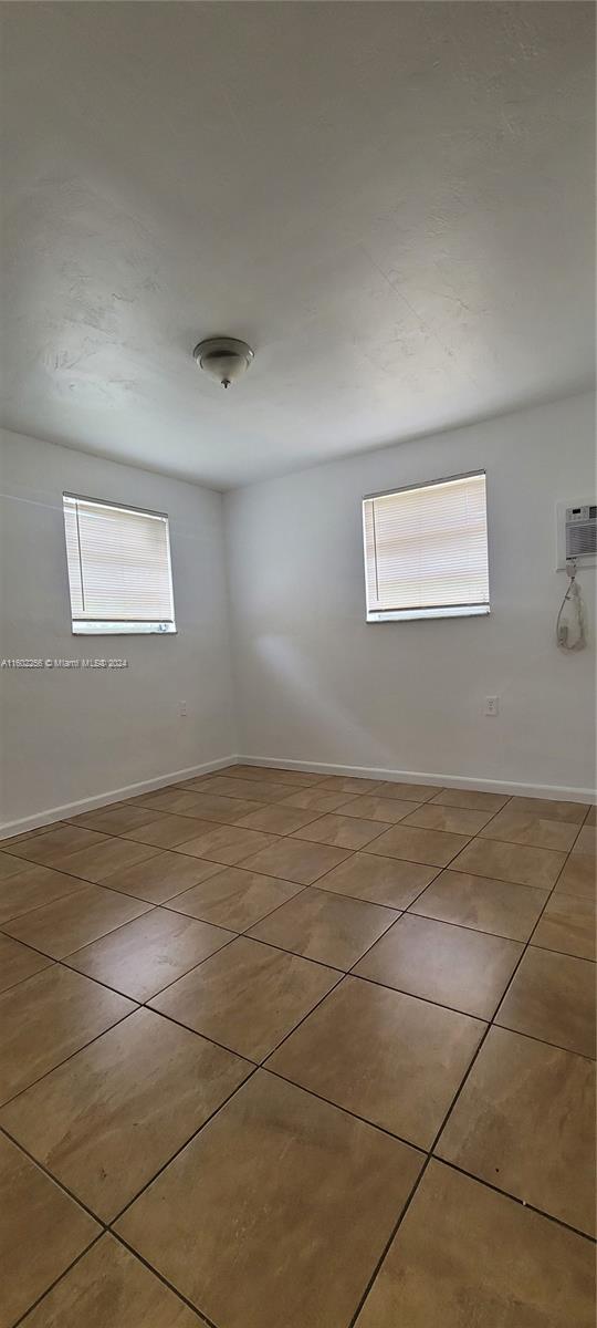567 Northwest 90th Street, Unit 3 Miami, FL 33150 - Photo 9 of 11 a view of an empty room with a window