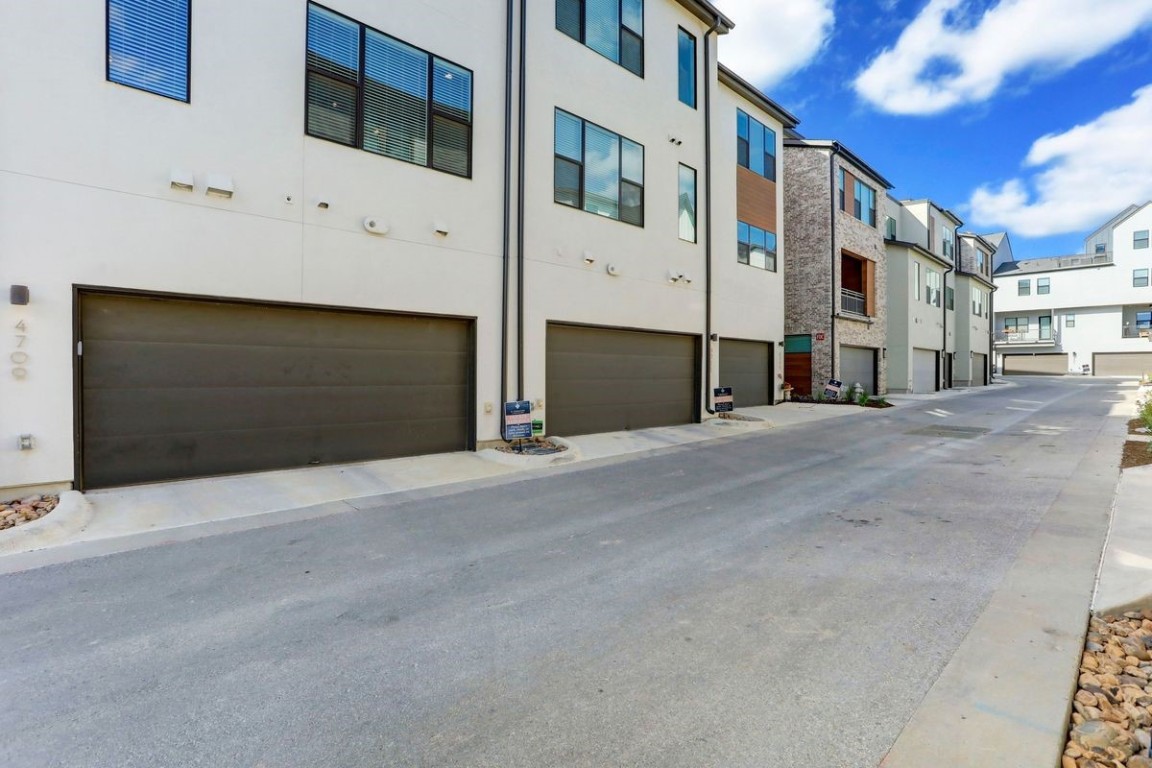 4709 Unity Circle, Unit 273 Austin, TX 78731 - Photo 14 of 14 a view of a building with a road