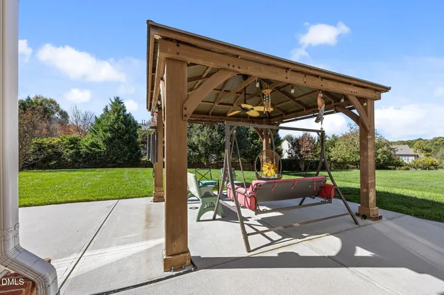 a view of a park with large trees