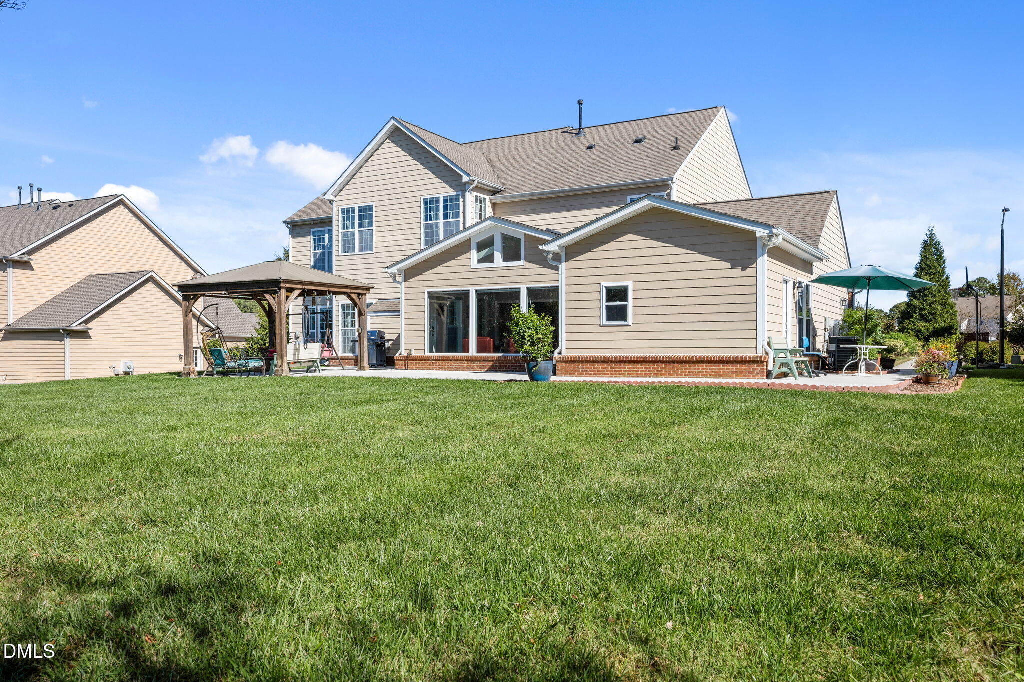 112 Rapport Drive Cary, NC 27519 - Photo 15 of 72 a view of a house with a big yard and large trees