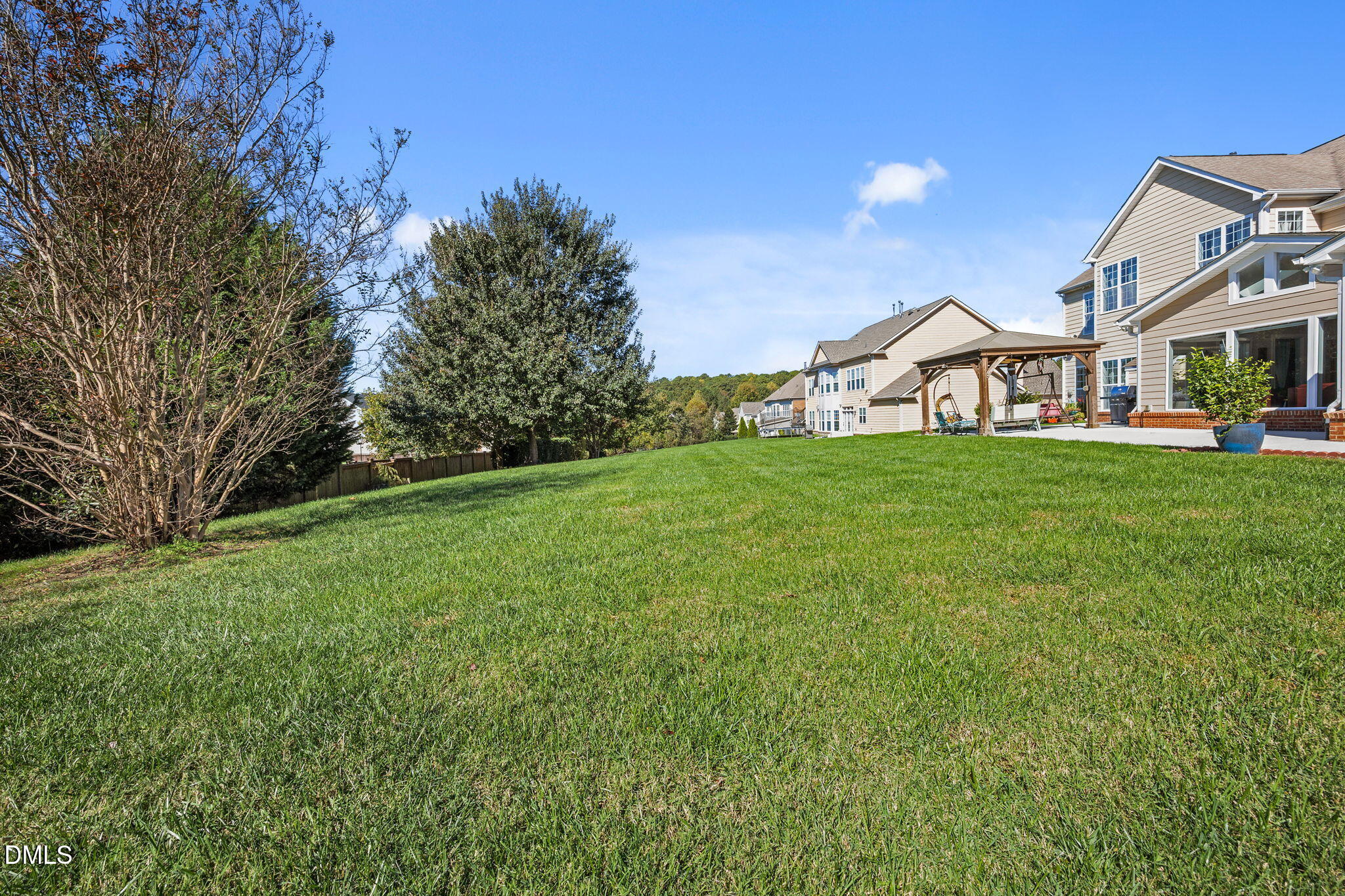 112 Rapport Drive Cary, NC 27519 - Photo 16 of 72 a view of a big yard with a house in the background