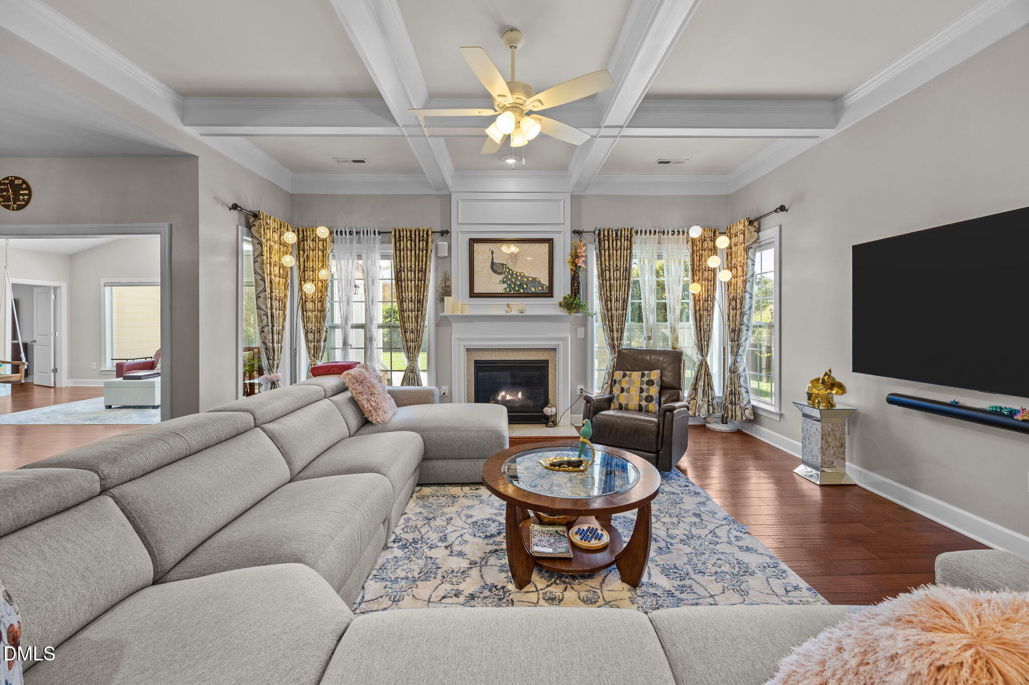 112 Rapport Drive Cary, NC 27519 - Photo 35 of 72 a living room with furniture a fireplace and a flat screen tv