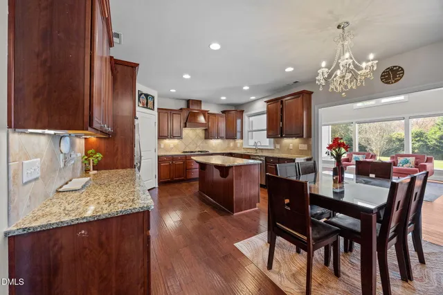 a view of a livingroom with furniture and a flat screen tv