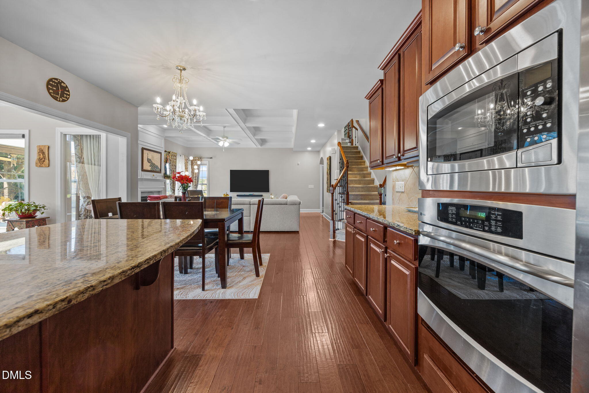 112 Rapport Drive Cary, NC 27519 - Photo 38 of 72 a large kitchen with stainless steel appliances granite countertop a stove and a view of dining room