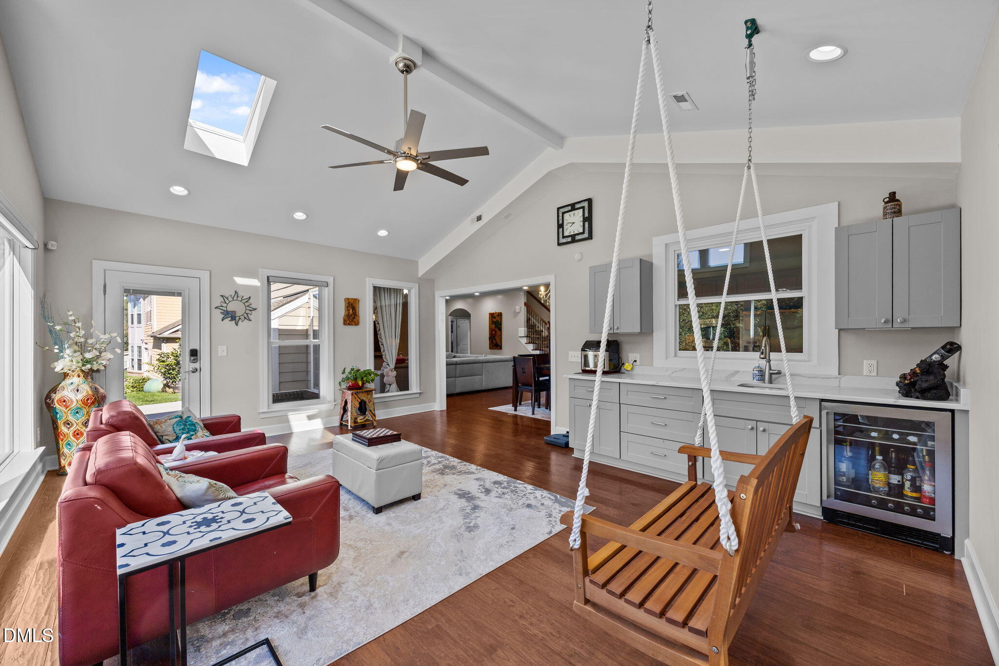 112 Rapport Drive Cary, NC 27519 - Photo 41 of 72 a living room with furniture a flat screen tv and wooden floor