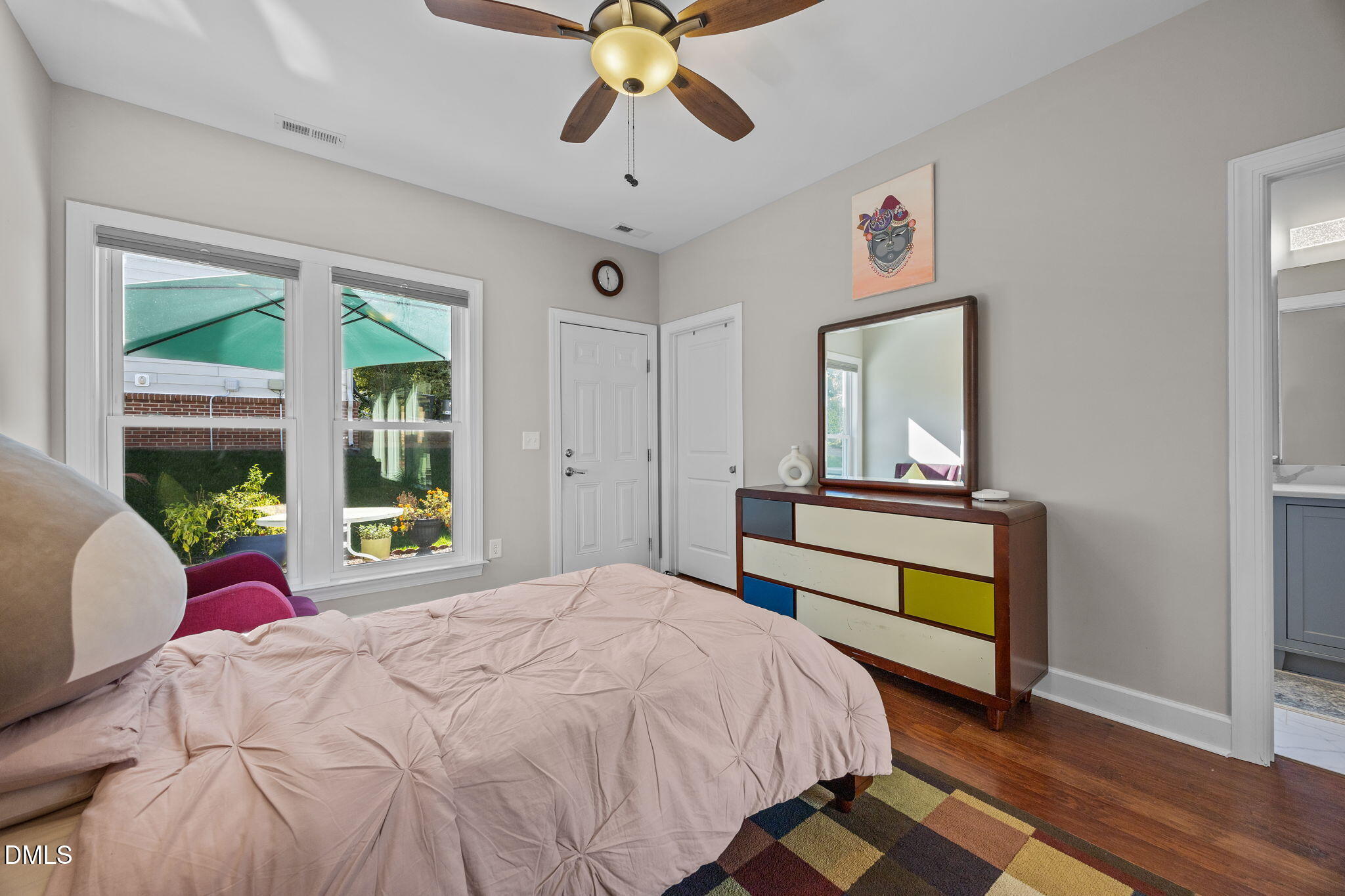 112 Rapport Drive Cary, NC 27519 - Photo 42 of 72 a bedroom with a bed a window and a chandelier