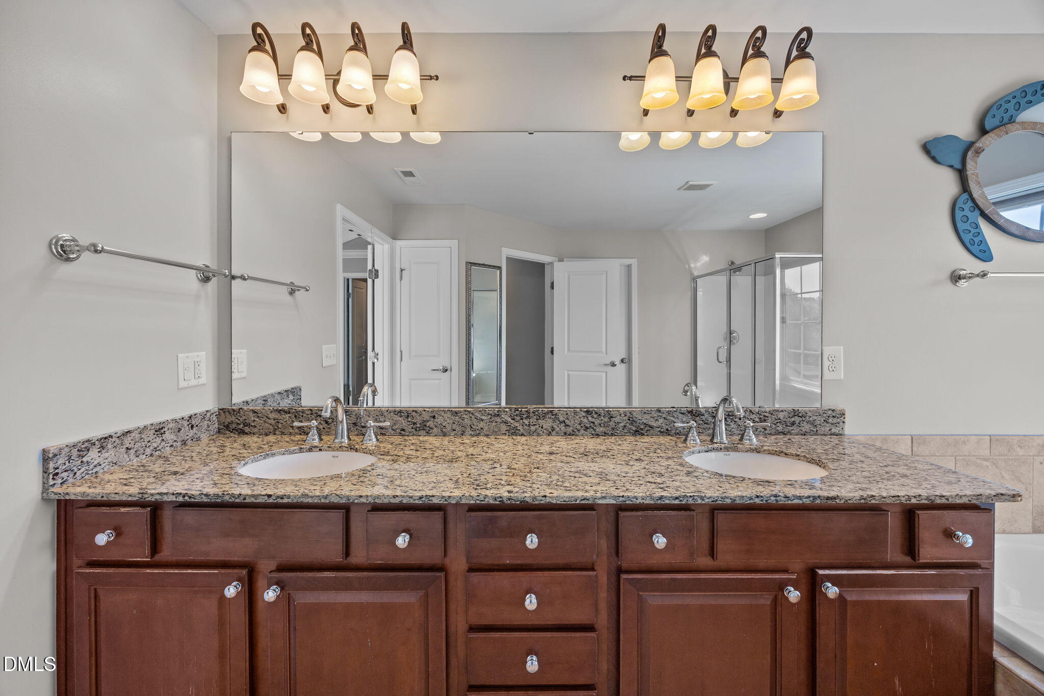 112 Rapport Drive Cary, NC 27519 - Photo 53 of 72 a bathroom with a granite countertop sink and a mirror