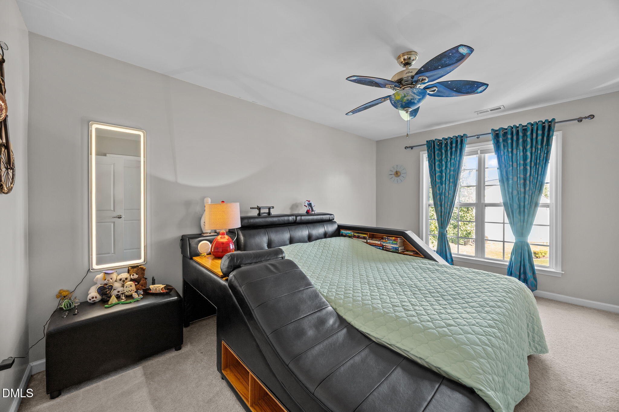 112 Rapport Drive Cary, NC 27519 - Photo 55 of 72 a bedroom with a bed and a chandelier