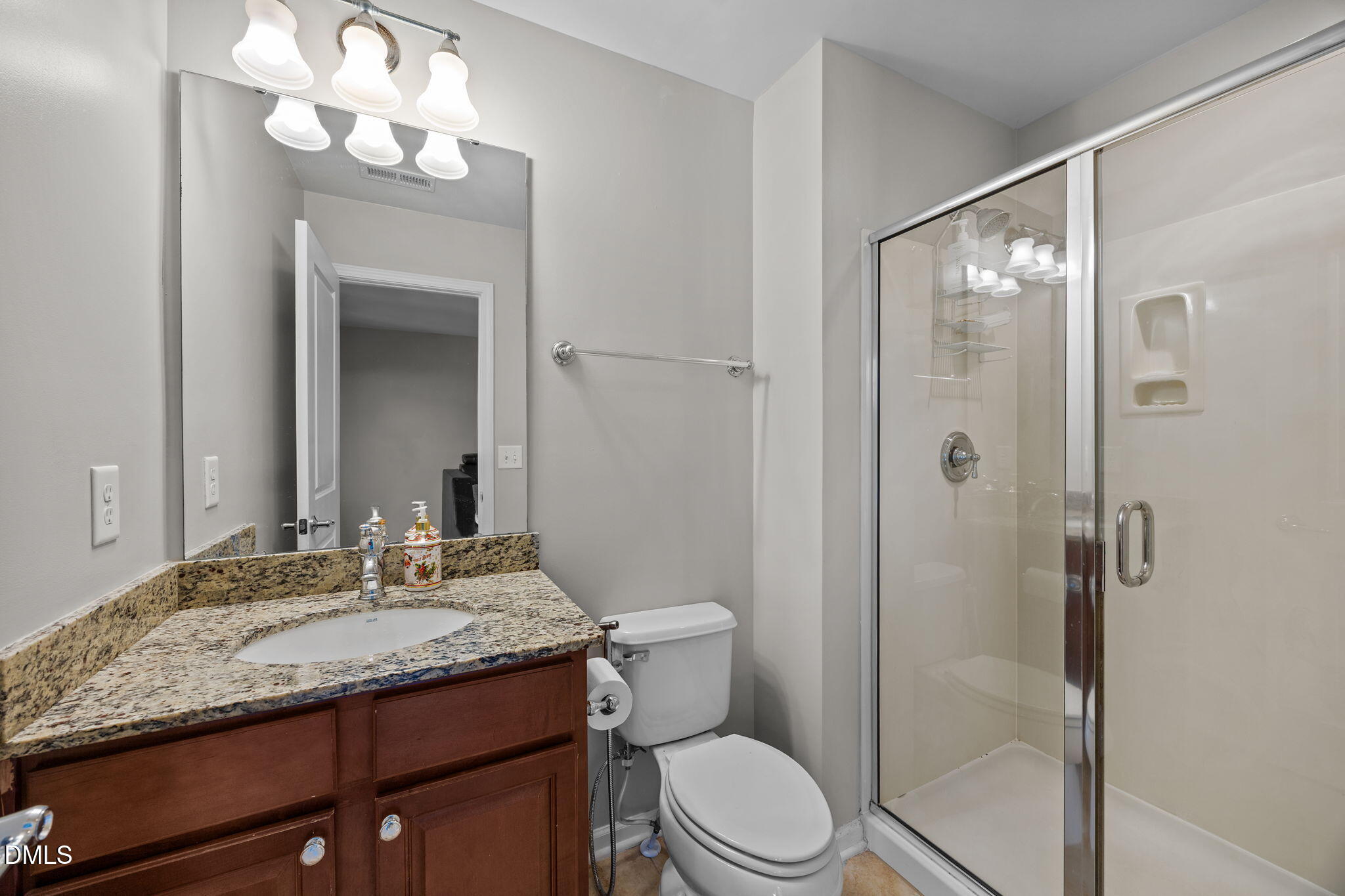 112 Rapport Drive Cary, NC 27519 - Photo 57 of 72 a bathroom with a granite countertop sink a toilet and shower
