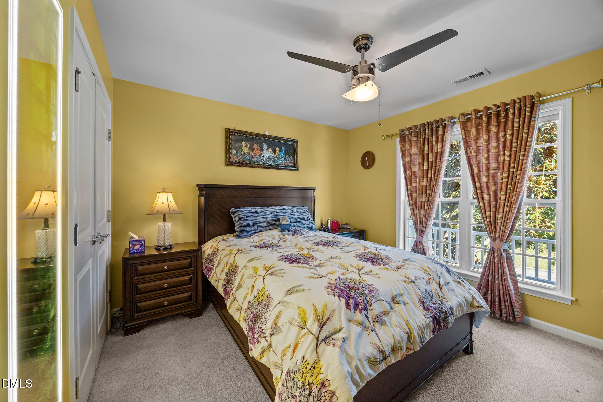 112 Rapport Drive Cary, NC 27519 - Photo 58 of 72 a bedroom with a bed and a chandelier