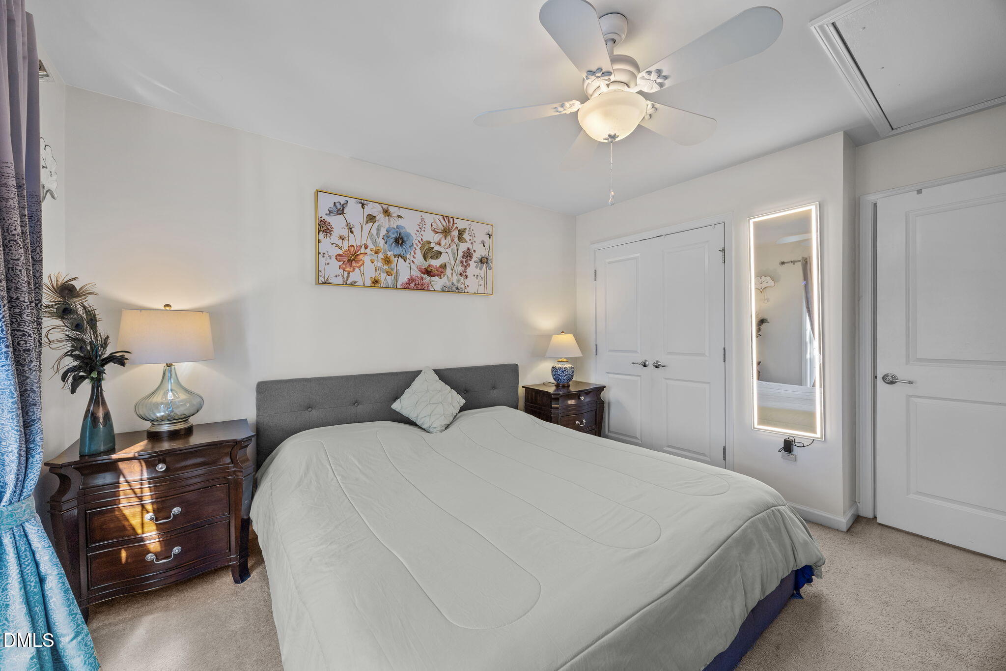 112 Rapport Drive Cary, NC 27519 - Photo 60 of 72 a bedroom with a bed and a chandelier