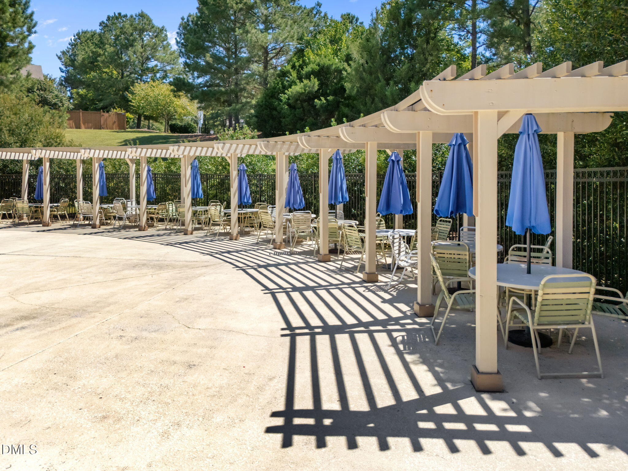 112 Rapport Drive Cary, NC 27519 - Photo 72 of 72 front view of a patio with a dining table and chairs with wooden floor