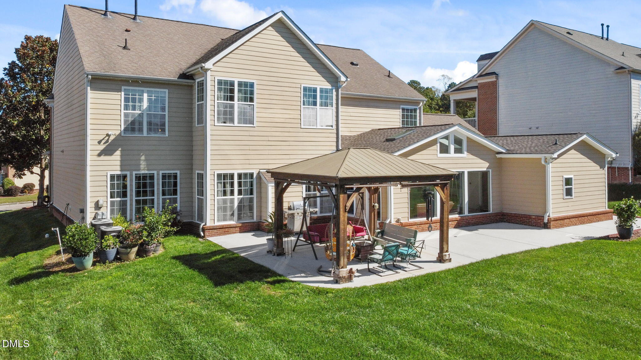 112 Rapport Drive Cary, NC 27519 - Photo 10 of 72 a view of a house with a yard and sitting area