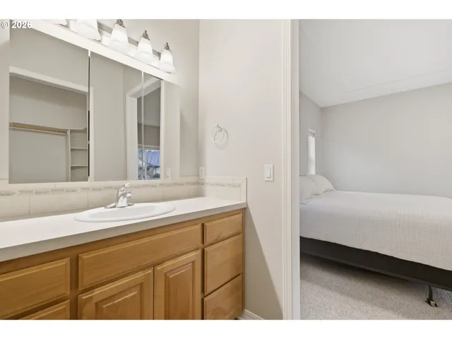a en suite bathroom with a sink and a mirror