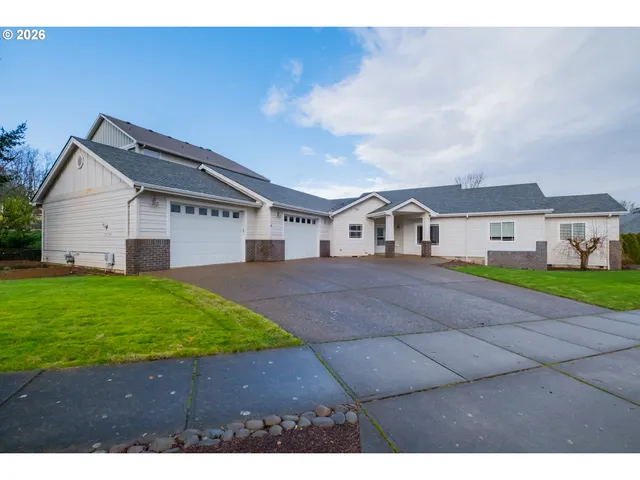 a aerial view of a house with a yard