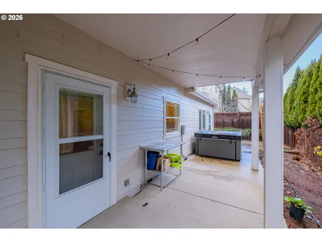 a backyard of a house with green space and outdoor seating