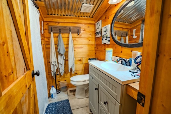 2167 Powdermill Hill Road Lawrenceburg, TN 38464 - Photo 17 of 33 a bathroom with a sink and a mirror