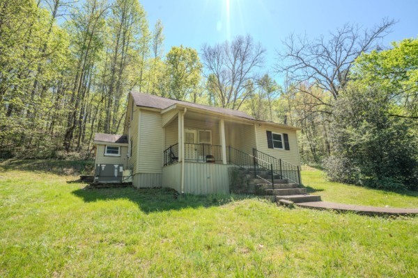 2167 Powdermill Hill Road Lawrenceburg, TN 38464 - Photo 19 of 33 a view of a house with a yard
