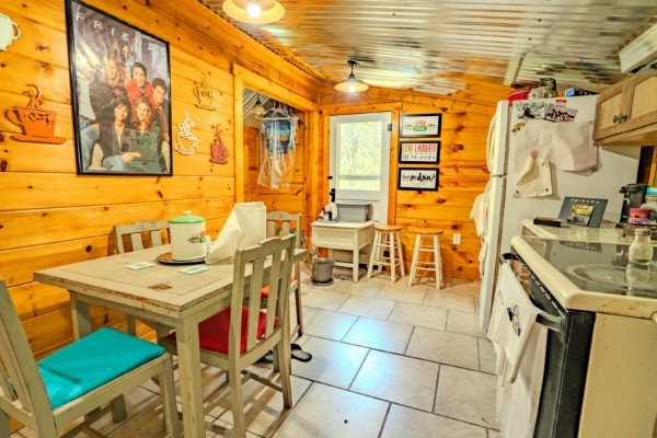 2167 Powdermill Hill Road Lawrenceburg, TN 38464 - Photo 10 of 33 a view of a patio with a table and chairs