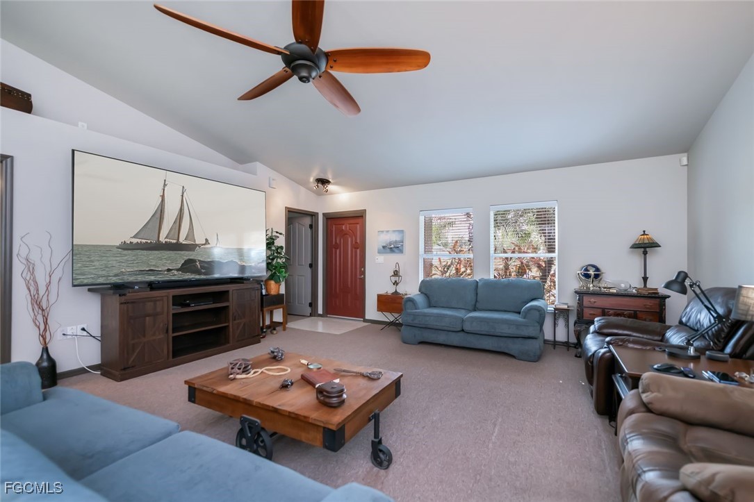 4108 13th Street Southwest Lehigh Acres, FL 33976 - Photo 13 of 48 a living room with furniture and a wooden floor