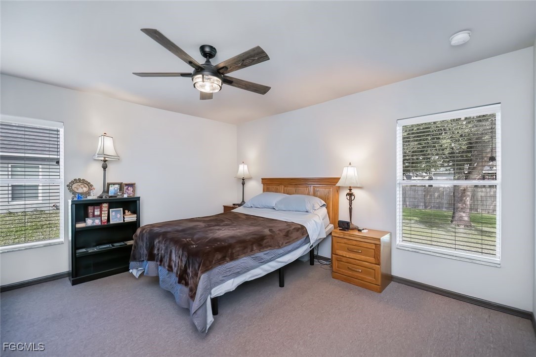 4108 13th Street Southwest Lehigh Acres, FL 33976 - Photo 17 of 48 a bed room with a bed and a window
