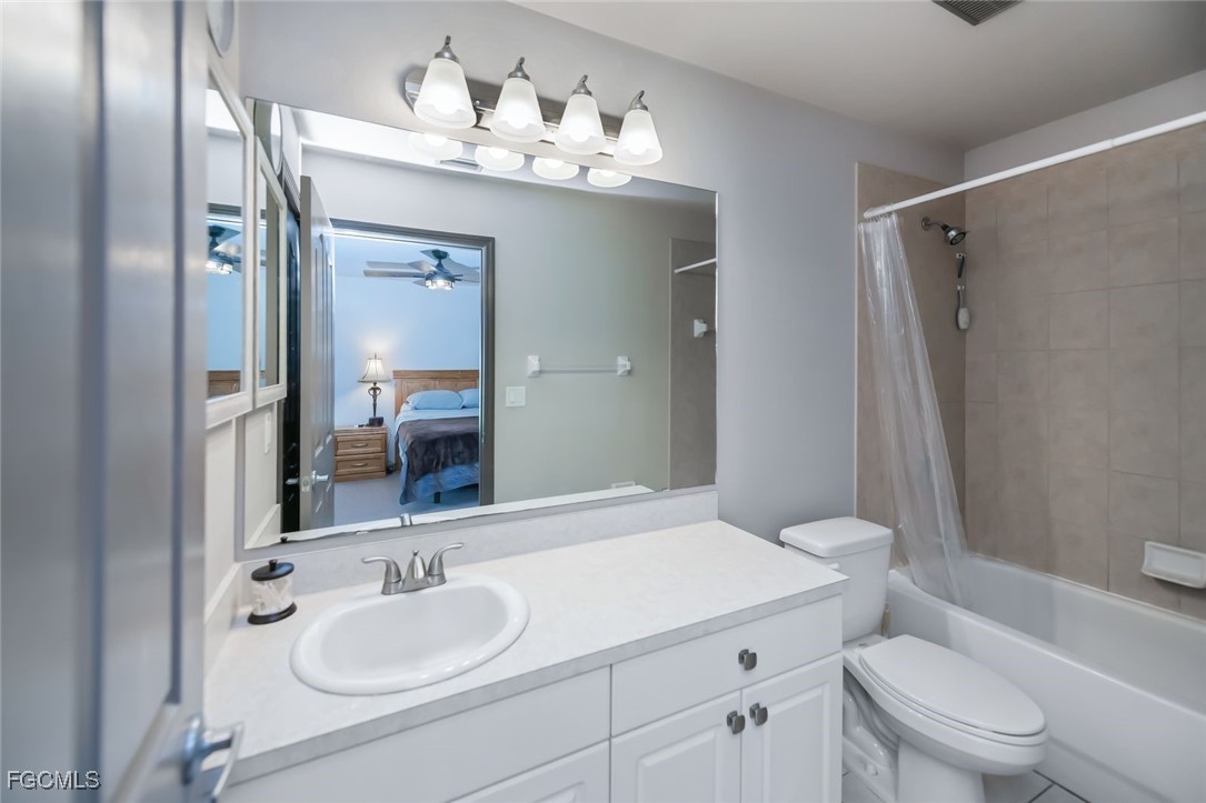 4108 13th Street Southwest Lehigh Acres, FL 33976 - Photo 20 of 48 a bathroom with a sink toilet vanity and shower