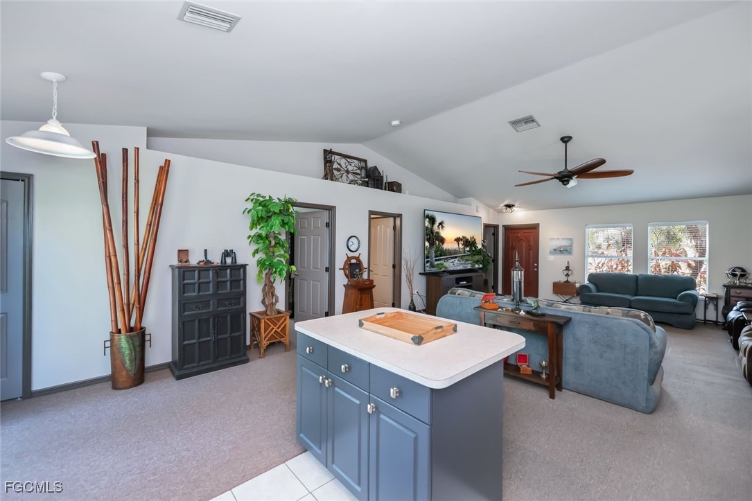 4108 13th Street Southwest Lehigh Acres, FL 33976 - Photo 2 of 48 a view of living room with furniture and a chandelier
