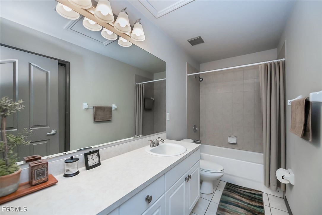 4108 13th Street Southwest Lehigh Acres, FL 33976 - Photo 24 of 48 a bathroom with a sink a toilet a mirror and shower