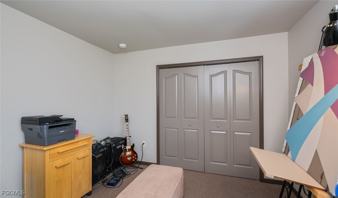 4108 13th Street Southwest Lehigh Acres, FL 33976 - Photo 25 of 48 a view of room with furniture and wooden floor