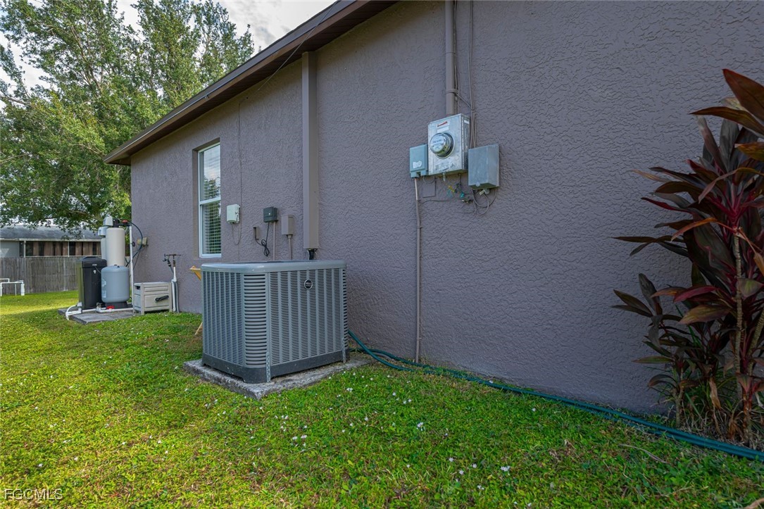 4108 13th Street Southwest Lehigh Acres, FL 33976 - Photo 45 of 48 a view of backyard with plants and outdoor seating