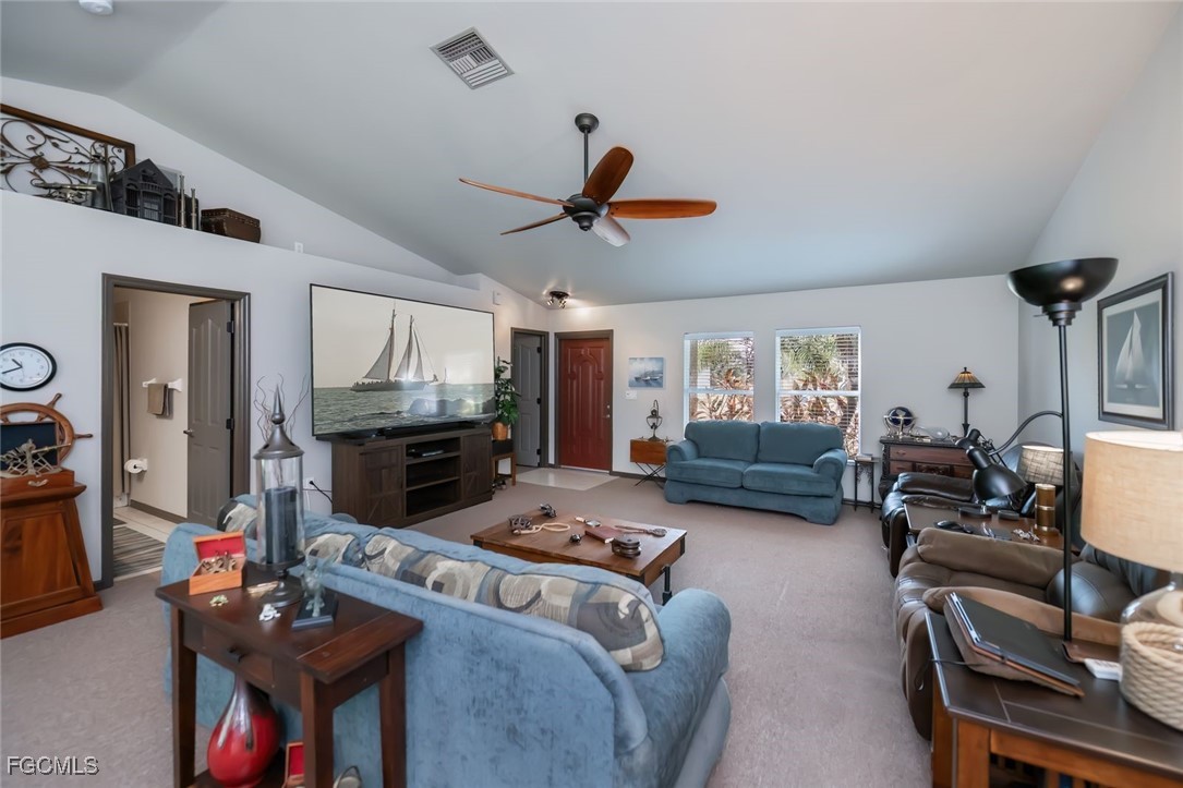 4108 13th Street Southwest Lehigh Acres, FL 33976 - Photo 9 of 48 a living room with furniture and a flat screen tv