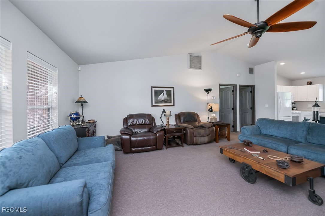 4108 13th Street Southwest Lehigh Acres, FL 33976 - Photo 10 of 48 a living room with furniture and a couch