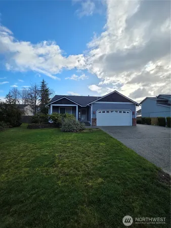 a view of a house with a yard