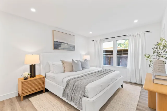 a bedroom with bed and a window