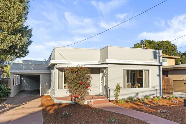 a front view of a house with a outdoor space