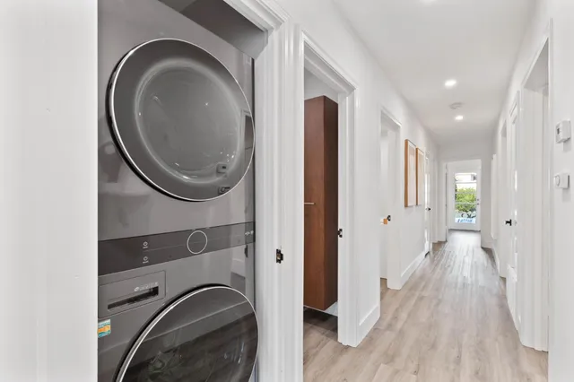 a view of a hallway with washer and dryer