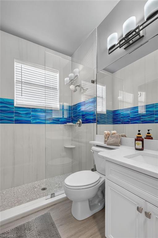9970 Rookery Circle Estero, FL 33928 - Photo 24 of 50 White vanity with shaker-style cabinetry, a solid surface countertop, and an integrated rectangular sink