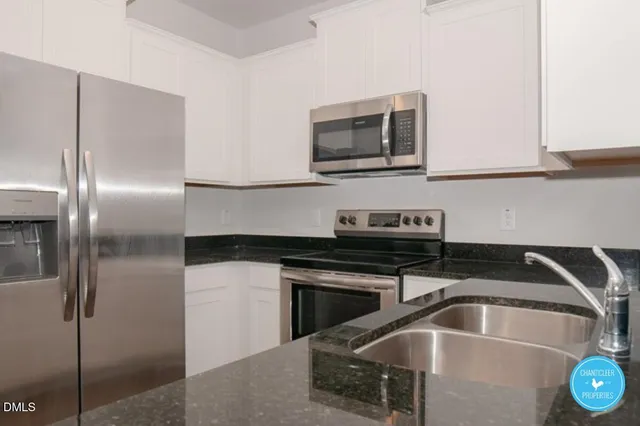 a kitchen with a sink and a microwave