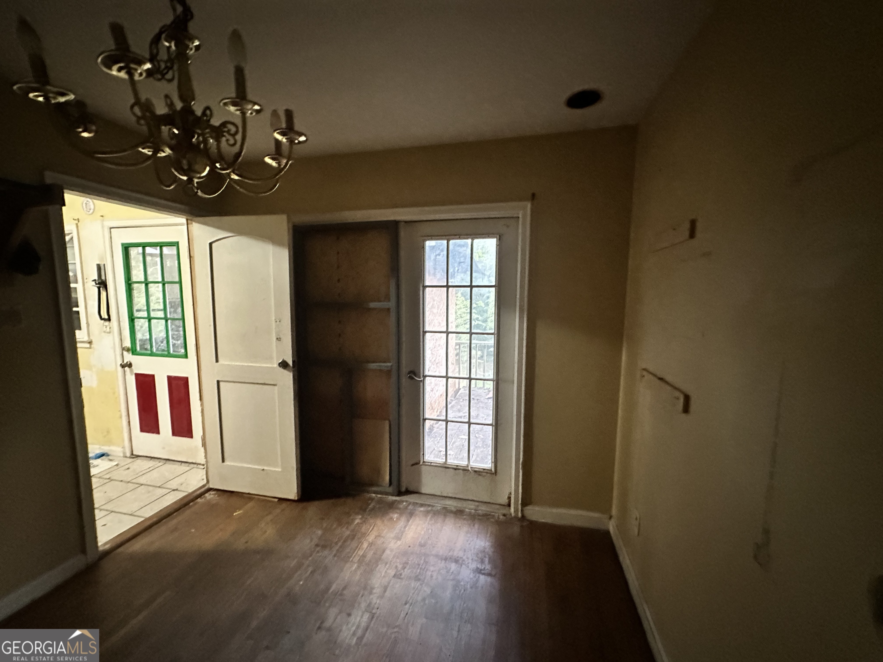 2389 Woodside Way Chamblee, GA 30341 - Photo 3 of 3 a view of a big room with wooden floor and chandelier