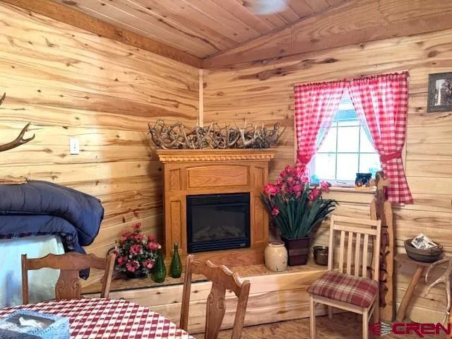a dining room with furniture and a fireplace