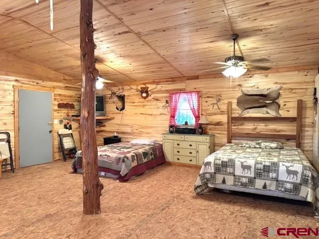 a bedroom with bed and window