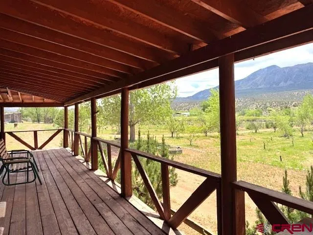 a view of a balcony with wooden floor