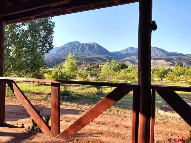 a view of mountain from a balcony