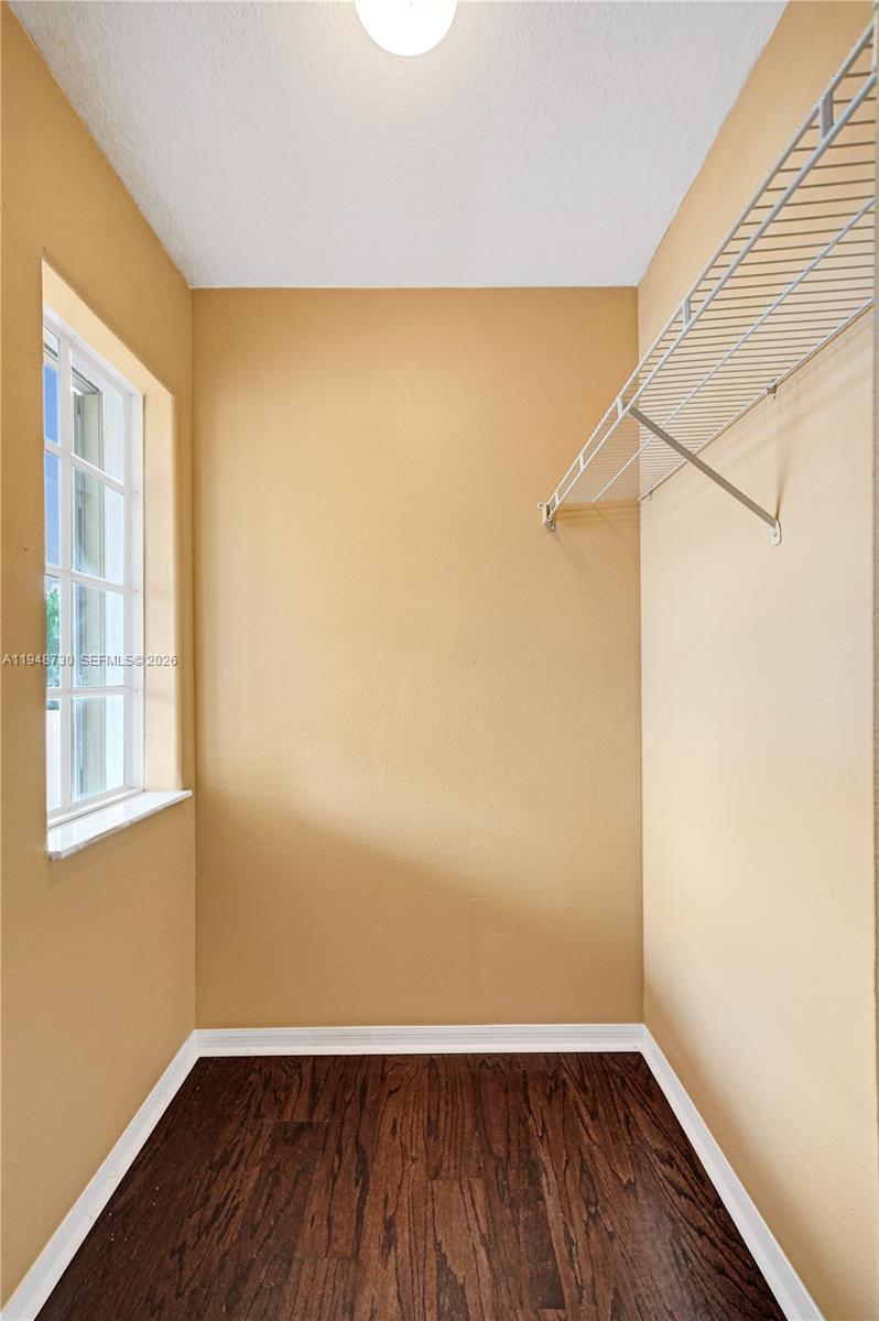 5502 Southwest 162nd Place Miami, FL 33185 - Photo 50 of 72 a view of a room with wooden floor and small window