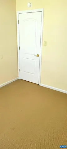 an empty room with a door